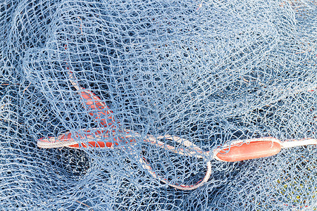 渔网和绳索漂浮钓鱼塑料浮标网络蓝色尼龙港口纠纷海岸图片