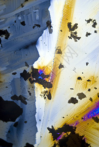 分极光中的烟尘颗粒和微晶晶体材料光谱矿物质魔法摄影水晶纳米照片显微显微镜图片