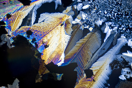 分极光中的烟尘颗粒和微晶晶体魔法纹理显微照片显微镜摄影水晶结晶宇宙纳米图片