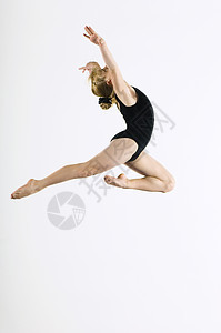 Gymnast 1617 飞跃空中侧视图行动运动员灵活性赤脚头发双腿服装跳跃愿望运动图片