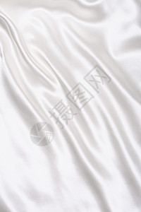 作为婚礼背景的平滑优雅白色丝绸织物纺织品涟漪投标曲线折痕新娘布料材料银色图片