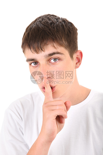 年轻人用手指指着他的嘴唇工作室青年秘密男人小伙子男性手势衬衫青少年震惊图片