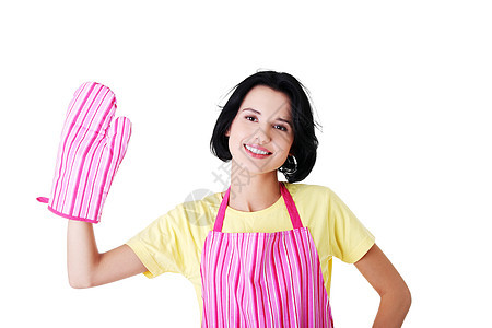 穿厨房围裙和厨房手套的年轻家庭主妇图片