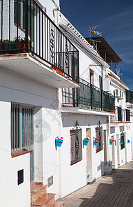 Mijas典型的白色房屋旅行扶手房子阳台楼梯城市栏杆花盆植物学街道图片