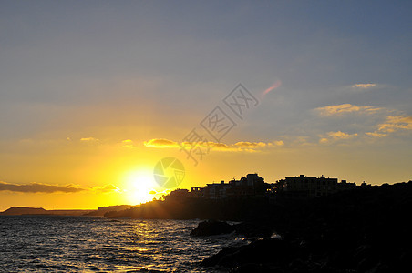 大西洋上空的日落海洋海滩海岸村庄天空日出地平线太阳支撑风景图片