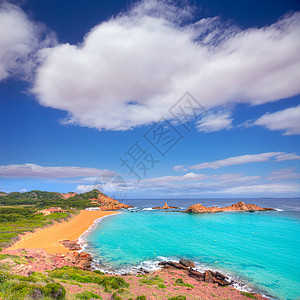 巴利阿里群岛Menorca的石头假期支撑天空海景海岸蓝色太阳地标场景图片