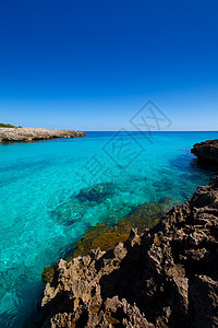 巴利阿里奇Ciutadella岛Talaier海滩天空地标泡沫支撑旅行波浪海岸线蓝色岩石晴天图片
