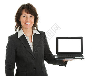 商业妇女提供手提笔记本电脑互联网手势推介会工作微笑套装快乐展示人士销售量图片