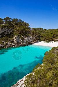 巴利阿里群岛Menorca的支撑岩石海岸太阳波浪蓝色海岸线海洋石头海滩图片
