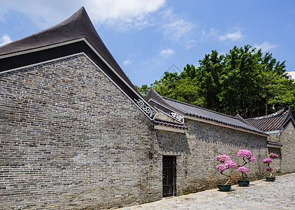 传统的中国传统建筑结构房子花园天空寺庙建筑学入口蓝色花盆石头植物背景图片