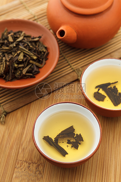 传统中国茶叶饮料陶器功夫飞碟食物杯子叶子文化工夫茶壶草本植物图片