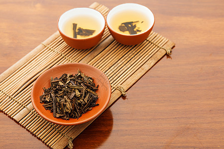 传统中国茶叶子功夫飞碟杯子草本植物食物茶碗饮料茶壶干叶图片