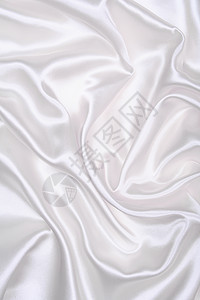 作为婚礼背景的平滑优雅白色丝绸投标银色织物曲线纺织品涟漪新娘布料材料折痕图片