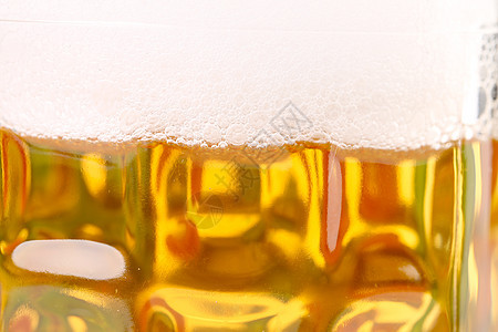 喝啤酒泡沫的杯子发泡啤酒棕色泡沫状干杯酒吧黄色白色气泡玻璃图片