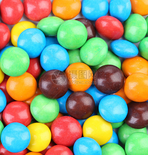 巧克力球在多彩的玻璃上白色团体绿色水果滴橙子多样性食物圆形黄色诱惑图片