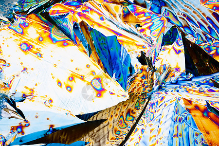 极化光束中的Tartaric酸晶体彩虹手性宏观光谱色水晶化学品照片显微食物科学图片