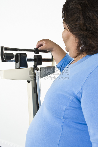 使用权重表的妇女肥胖保健意识身体美丽医学医疗一人成人棕色图片