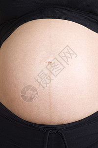 孕妇中产期特写女士母性裁剪大事成人怀孕肚脐影棚人生图片
