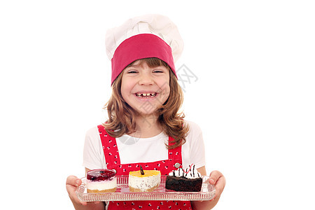 快乐的小女孩做蛋糕软糖糖果厨师甜点童年食物青年女孩乐趣微笑图片