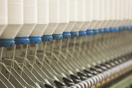 特写旋转工厂的机械部分设备部件纺织品纺纱生产团体组织命令机器材料水平制造业图片