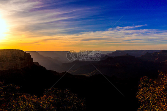 亚利桑那州大峡谷国家公园太阳橙子蓝色荒野天空侵蚀石头沙漠日落悬崖图片