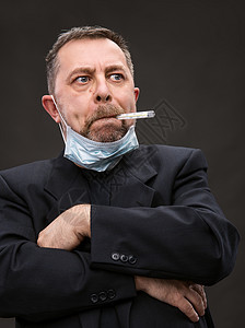 戴带温度计的医务面罩的人预防性情绪程序悲伤呼吸器面具外科发烧疾病防御图片