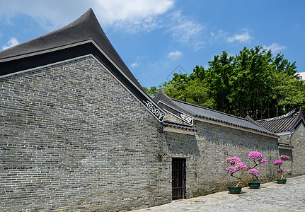 传统中国菜园寺庙石头入口植物花园蓝色房子天空建筑图片