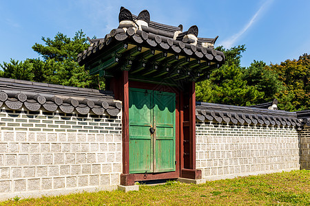 传统的韩国传统建筑结构植物砖墙皇帝建筑学寺庙历史房子花园入口文化背景图片