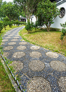 中国花园的泥石小路卵石花园石头院子人行道建筑草地岩石庭院公园图片