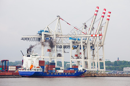 港口码头集装箱船上的集装箱汉堡城市房子贸易起重机办公室出口血管金属货物图片