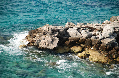 与海滩的交接假期海岸线海洋岩石背景图片