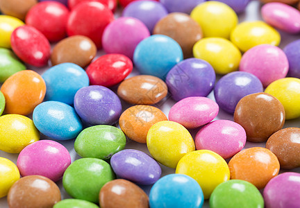 彩色糖果堆叠红色食物宏观棕色粉色黄色紫色小吃绿色橙子图片