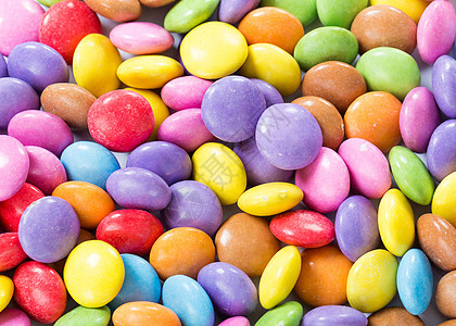 彩色糖果堆叠红色巧克力紫色白色小吃绿色团体甜点黄色棕色图片