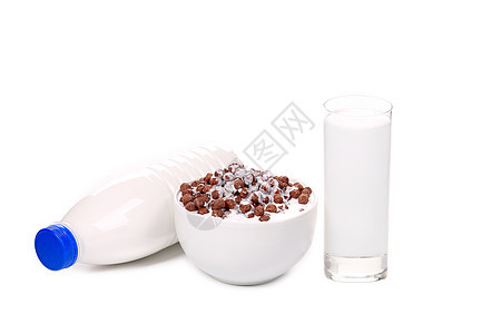 一碗玉米片和牛奶勺子健康饮食圆形孩子们早餐白色瓶子食物谷物巧克力图片