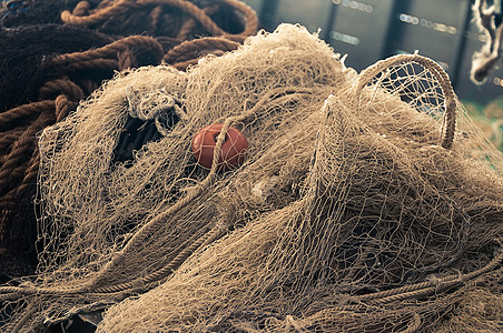 捕鱼渔网棕色渔夫航海乡村海洋浮标港口绳索木头材料图片