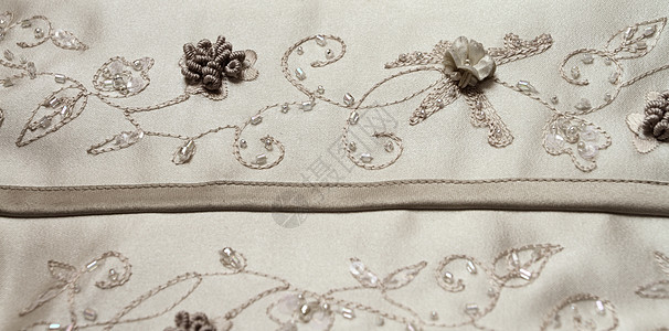结婚礼服细目刺绣婚礼女性裙子仪式纺织品奢华魅力宏观宝石图片