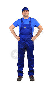 穿蓝制服的工人管道劳动建筑腰部帽子靴子工业蓝色白色职业图片