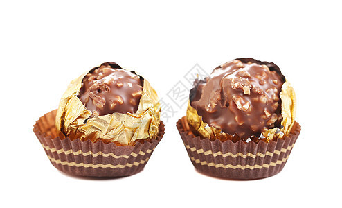巧克力金盆子贴近了白色甜点松露糖果食物飞碟糕点图片