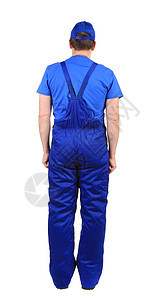 穿蓝制服的工人 后视线工业服务机械建筑靴子男人帽子工作腰部蓝色图片