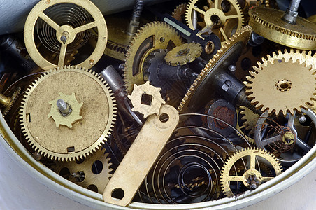 罐装时间     罐中时钟机制的一部分工作车轮轮子罐头棘轮机械宏观概念齿轮工具图片