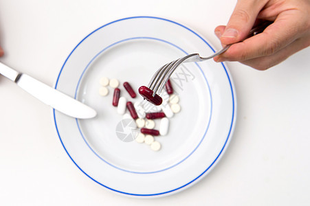 医药用药和餐桌止痛药菜单药店白色胶囊疾病盘子药品维生素饮食图片