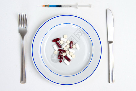 医药用药和餐桌盘子饮食疾病胶囊白色药片医疗药店食物药剂图片