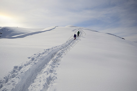 技术熟练自由粉雪成就雪鞋天空勘探运动冰川愿望季节图片