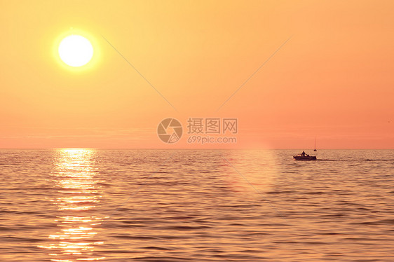 夏季海上日落海浪海岸砗磲假期地平线支撑反射风车海滩太阳图片
