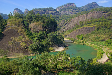 中国福建省武伊山峡谷 中国环境阳光晴天风景太阳溪流石头山沟木头林地图片