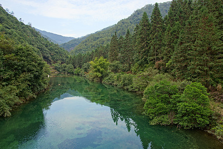 中国福建省武伊山峡谷 中国太阳溪流阳光场景石头林地山沟木头蓝色岩石图片