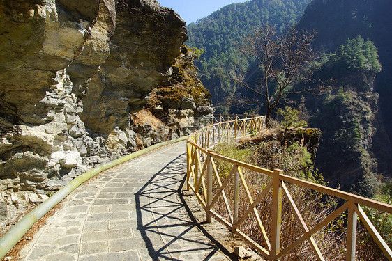 中国云南省达利市康山山探险游客环境旅行旅游岩石假期石头阳光高山风景图片