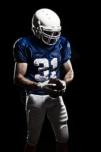 足球运动员文化男性职业力量成人蓝色制服头盔肌肉动员图片