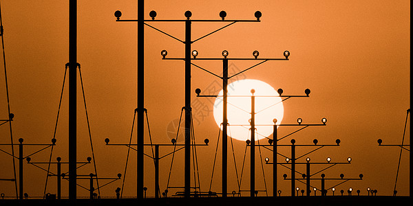 洛杉矶机场水平阳光天空摄影目的地全景运输指导飞机场日落图片