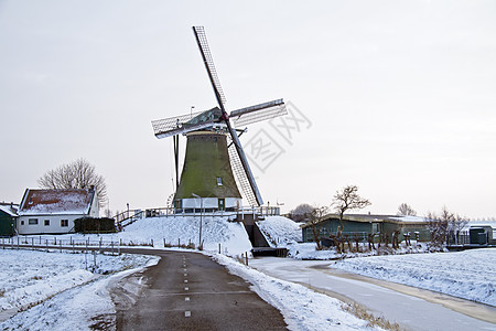 荷兰农村传统风力车荷兰 2002年小孩地标风景历史房子历史性风车堤防树木图片